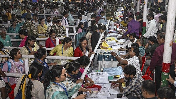 <div class="paragraphs"><p>Polling officials from different polling stations deposit EVMs at the AN College strong room after voting for the first phase of the Bihar Assembly elections, in Patna.</p></div>