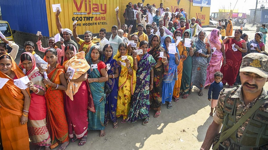 <div class="paragraphs"><p>People queuing up to cast their votes outside a polling station at Danapur in Patna.</p></div>