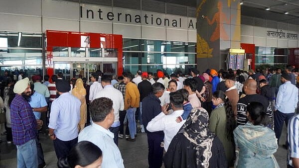 <div class="paragraphs"><p>People wait outside the arrivals’ exit at the Indira Gandhi International (IGI) Airport, in New Delhi, in New Delhi.</p></div>