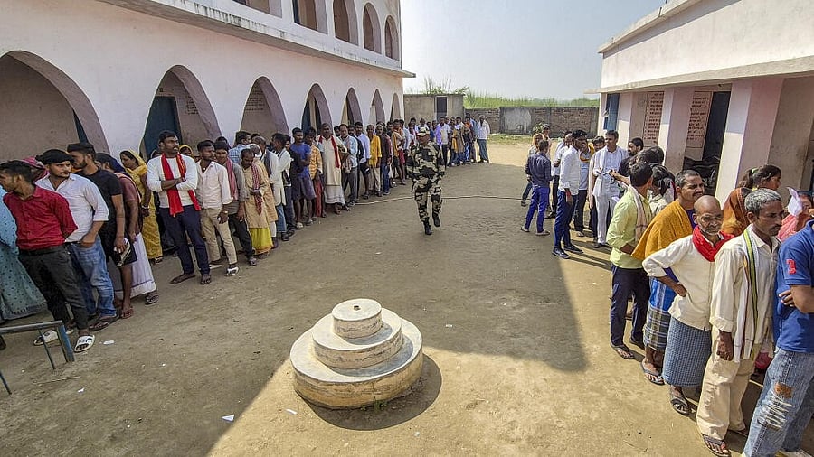 <div class="paragraphs"><p>Voters wait in a queue to cast votes at a polling station during the first phase of the Bihar Assembly elections, at Hajipur in Vaishali.</p></div>