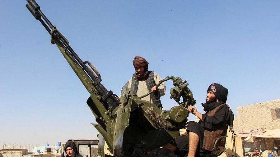 <div class="paragraphs"><p>An Afghan Taliban fighter sit next to an anti-aircraft gun near the Afghanistan-Pakistan border in Spin Boldak, Kandahar Province, following exchanges of fire between Pakistani and Afghan forces in Afghanistan.</p></div>