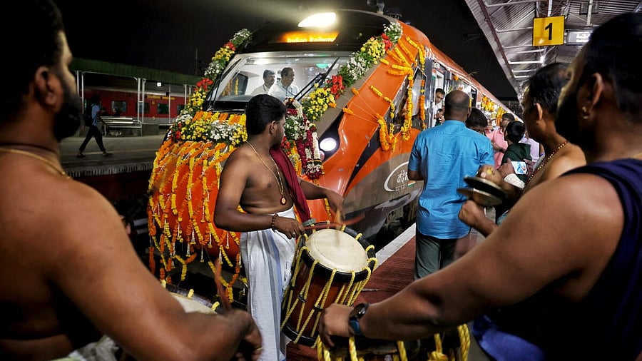 <div class="paragraphs"><p>PM Modi flags off 4 new Vande Bharat trains:&nbsp;Artistes perform near a new Vande Bharat train, at KSR railway station, in Bengaluru, Saturday, Nov. 8, 2025. PM Modi on Saturday flagged off four new Vande Bharat Express trains, including the Ernakulam-Bengaluru route, from the Banaras railway station.Credit: PTI</p></div>