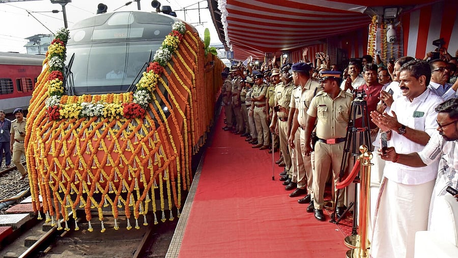 <div class="paragraphs"><p>Security personnel keep vigil as a new Vande Bharat train leaves the Ernakulam South railway station following its virtual flag-off by Prime Minister Narendra Modi, in Ernakulam, Kerala.</p></div>