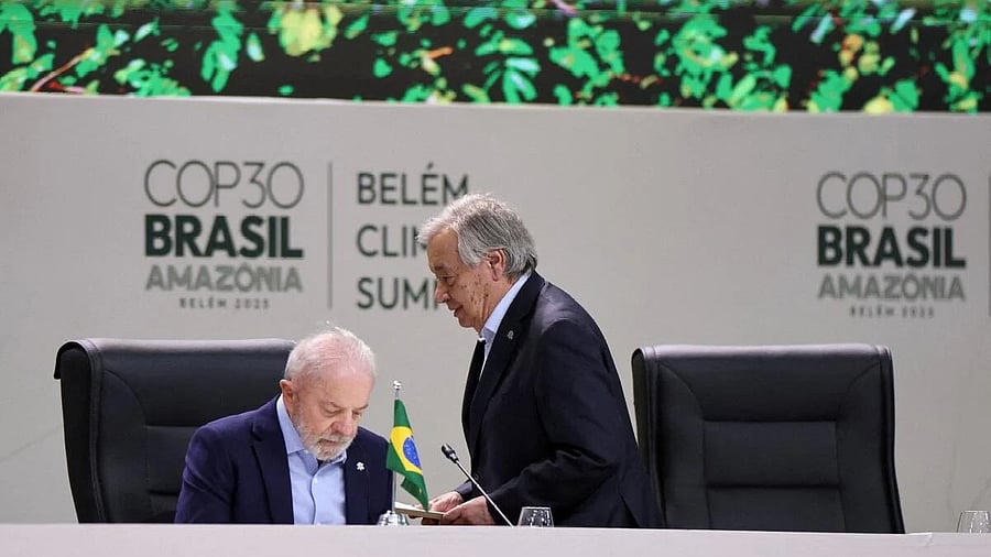 <div class="paragraphs"><p>United Nations Secretary-General Antonio Guterres walks next to Brazil's President Luiz Inacio Lula da Silva as they attend the opening of the Belem Climate Summit plenary session, as part of the United Nations Climate Change Conference (COP30), in Belem, Brazil, November 6, 2025.</p></div>