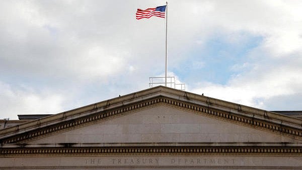 <div class="paragraphs"><p>The American flag flies over the US Treasury building in Washington, US.</p></div>