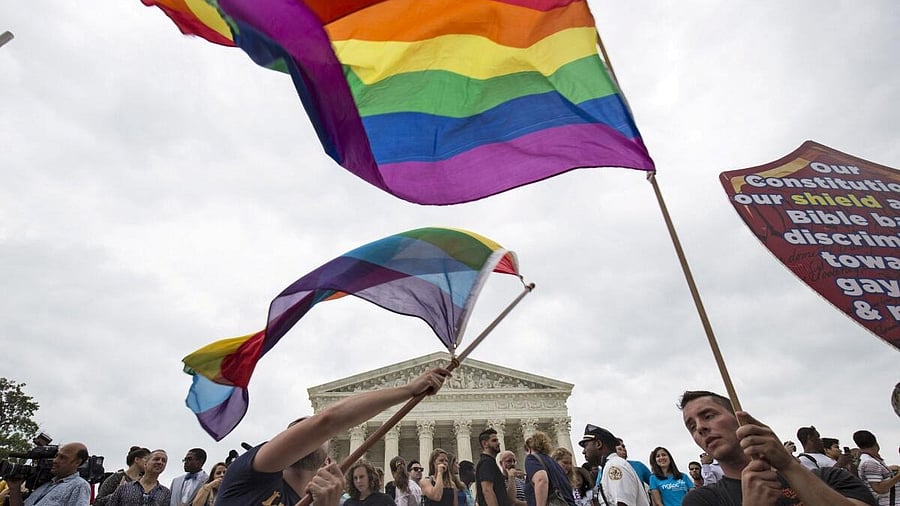 <div class="paragraphs"><p>FILE PHOTO: Supporters of gay marriage wave the rainbow flag after the U.S. Supreme Court ruled on Friday that the U.S. Constitution provides same-sex couples the right to marry at the Supreme Court in Washington June 26, 2015.</p></div>