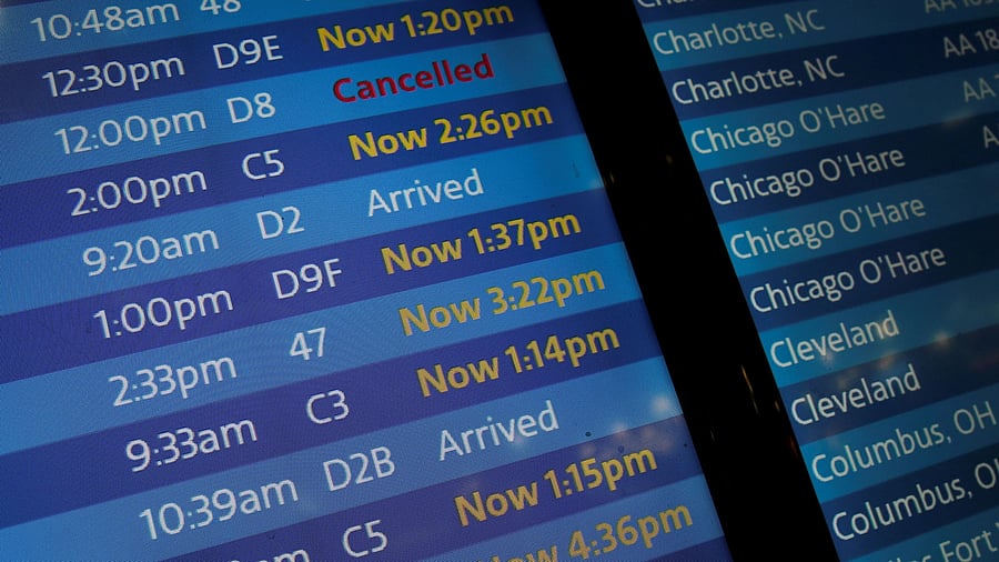 <div class="paragraphs"><p>Delayed and cancelled flights are seen on a video display at LaGuardia Airport in New York City </p></div>