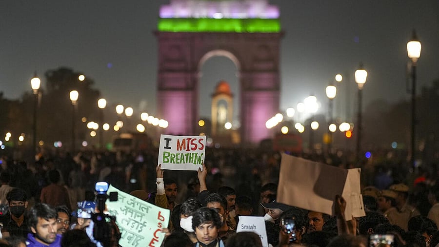 <div class="paragraphs"><p>A demonstrator holds a placard during a protest over the deteriorating air quality in the national capital region, in New Delhi on Sunday. Credit: PTI Photo </p></div>