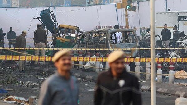 <div class="paragraphs"><p>Security personnel work at the site of an explosion near the historic Red Fort in Delhi</p></div>