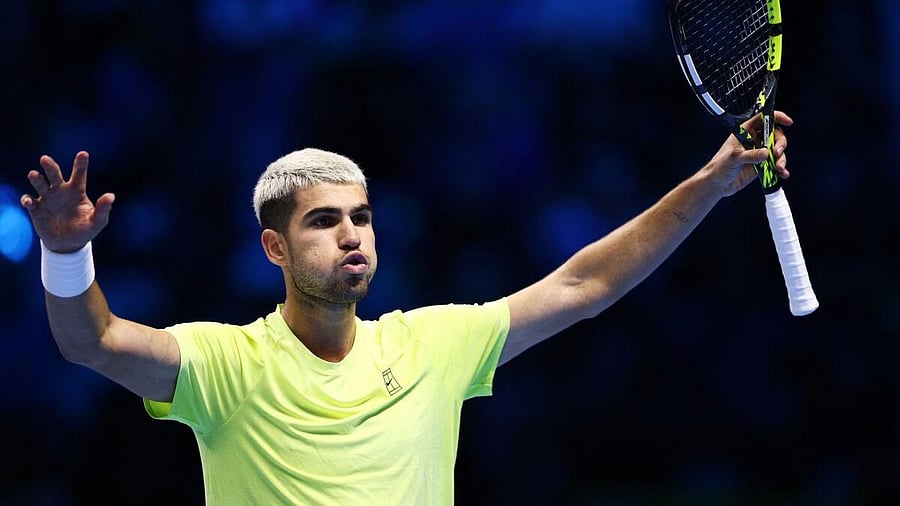 <div class="paragraphs"><p>Alcaraz celebrates after winning his group stage match against Taylor Fritz</p></div>