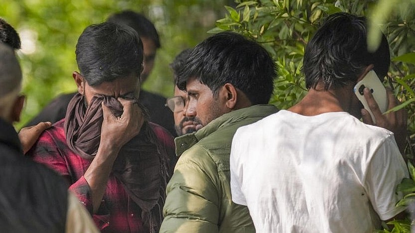 <div class="paragraphs"><p>Relatives of a victim of the Delhi car blast outside the mortuary at Maulana Azad Medical College in New Delhi on Tuesday. </p></div>