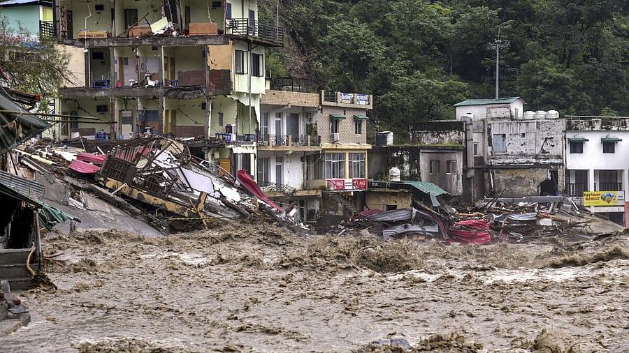 <div class="paragraphs"><p>Houses near the river lie in ruins after a downpour triggered a cloudburst and landslides, at Sahastradhara, in Dehradun.</p></div>
