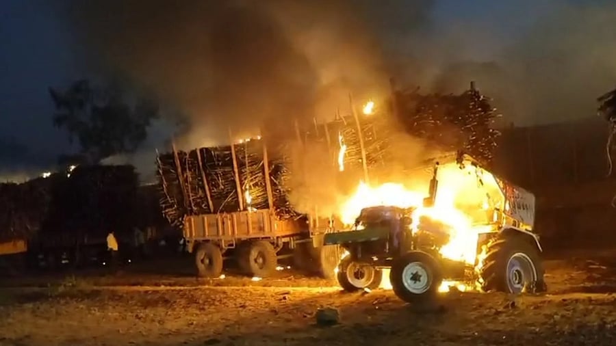 Loads of sugarcane burn after they were set ablaze by angry farmers at Godavari sugar factory at Sameerawadi in Rabakavi-Banahatti taluk of Bagalkot district on Thursday.