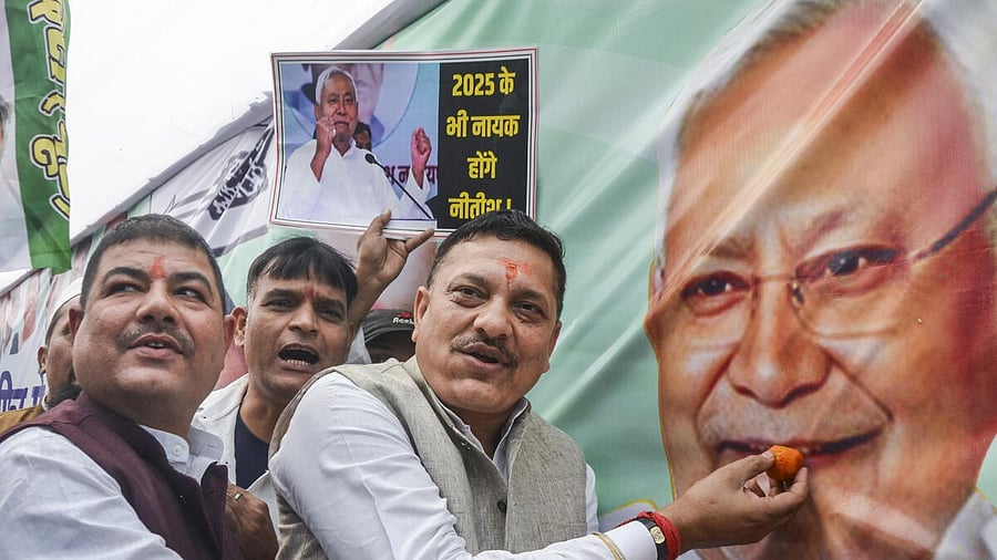 <div class="paragraphs"><p> JDU members celebrate as the NDA alliance leads during the counting of votes of the Bihar Assembly elections, in Patna.</p></div>