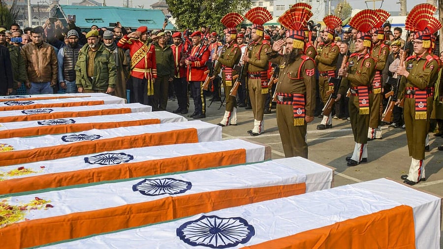 <div class="paragraphs"><p>Security personnel pay tribute to the victims who were killed in an accidental explosion which ripped through Nowgam police station late Friday night, in Srinagar.</p></div>