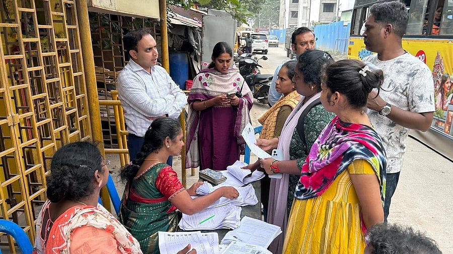 <div class="paragraphs"><p>BLO's distributing enumeration forms in Tamil Nadu. </p></div>