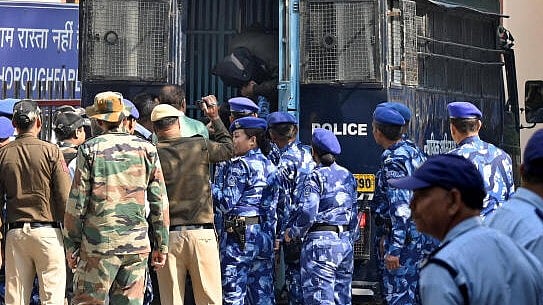 <div class="paragraphs"><p>Amir Rashid Ali, a resident of Pampore in Indian Kashmir, is escorted by police after he was arrested by NIA, in New Delhi</p></div>