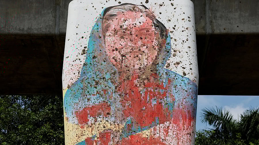 <div class="paragraphs"><p>FILE PHOTO: A mural of Bangladeshi Ex Prime Minister Sheikh Hasina is seen vandalised by protesters days before in Dhaka, Bangladesh, August 5, 2024. </p></div>