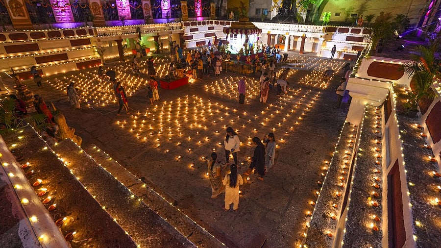 <div class="paragraphs"><p>Devotees light earthen lamps at a temple during Laksha Deepotsava celebrations, marking the culmination of the Kartika month, in Bengaluru, Karnataka.</p></div>