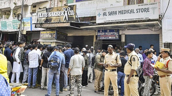 <div class="paragraphs"><p>People gather outside a travel agents office in Mallepally, after at least 45 people, most of them from Hyderabad, were killed in a bus accident in Saudi Arabia.</p></div>