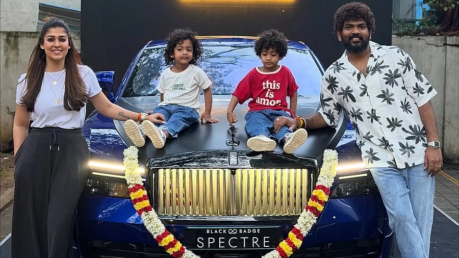 <div class="paragraphs"><p>Nayanthara and her family pose next to a Rolls Royce car.</p></div>