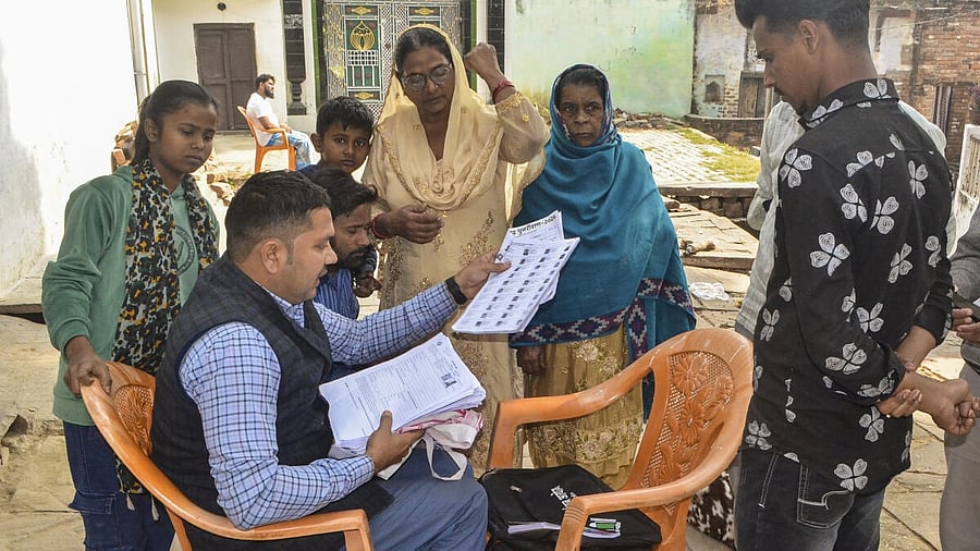 <div class="paragraphs"><p> A Booth Level Officer (BLO) explains the details of enumeration forms to voters for the special intensive revision (SIR) of electoral rolls.</p></div>