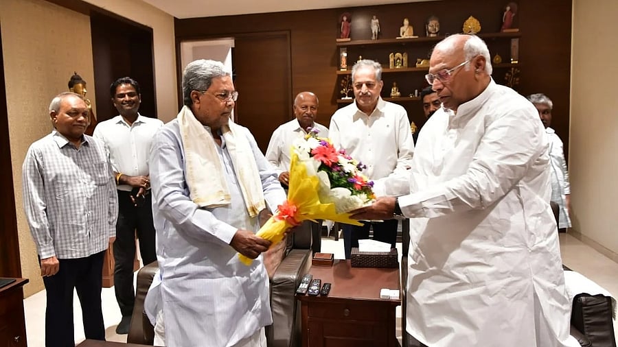 CM Siddaramaiah with AICC president Mallikarjun Kharge in Bengaluru on Saturday.