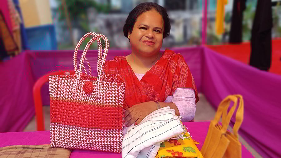 <div class="paragraphs"><p>Ari Roy Choudhury from Nadia sits with their products at the Rongdhonu Mela in Kolkata on Sunday, November 23.</p></div>