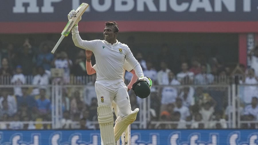 <div class="paragraphs"><p>South Africa's Senuran Muthusamy celebrates his century during the day two of the second Test cricket match of a series between India and South Africa, at ACA Stadium in Guwahati, Sunday, Nov. 23, 2025.</p></div>