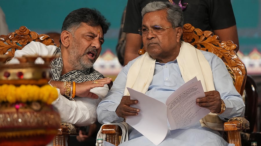 <div class="paragraphs"><p>Chief Minister Siddaramaiah and Deputy Chief Minister D K Shivakumar share a word during a programme in Shidlaghatta in Chikkaballapur district on Monday.&nbsp;</p></div>