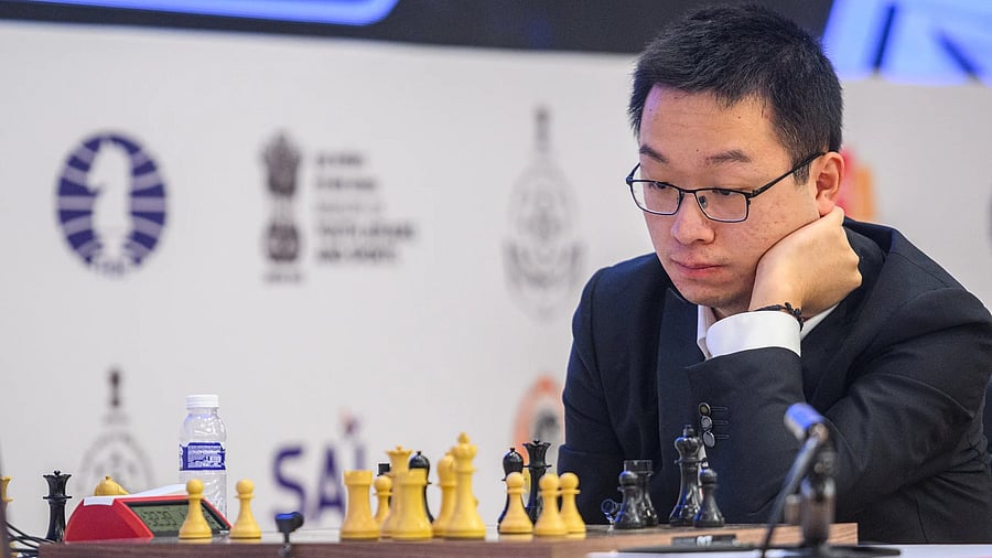<div class="paragraphs"><p>Wei Yi of China ponders a move against Javokhir Sindarov of Uzbekistan in their World Cup final on Monday. </p></div>