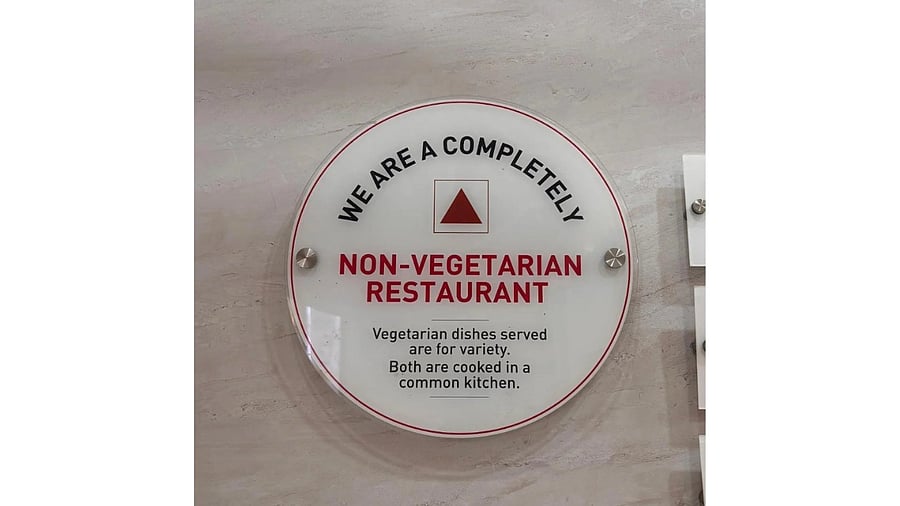 <div class="paragraphs"><p>The signboard at a restaurant in Kerala</p></div>