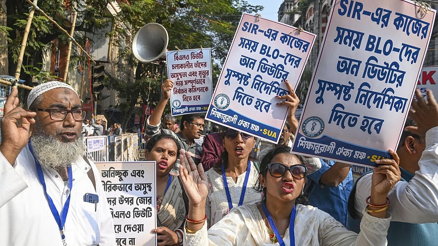 <div class="paragraphs"><p>Members of the Booth Level Officers (BLO) stage a protest near the Chief Electoral Officer's office, demanding relief from excessive workload under the 'SIR' system, in Kolkata.</p></div>