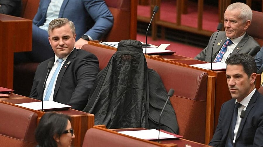 <div class="paragraphs"><p>Senators react as One Nation leader Pauline Hanson wears a burqa in the Senate chamber at Parliament House in Canberra, Australia.</p></div>