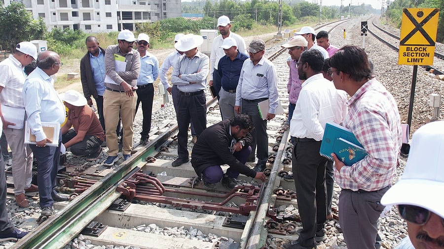 <div class="paragraphs"><p>Commissioner of Railway Safety (Southern Railway) AM Chowdhary inspects the Karmelaram-Bellandur Road double line on Tuesday.  </p></div>