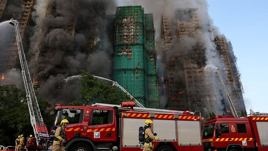 <div class="paragraphs"><p>Firefighters work as efforts are underway to extinguish flames engulfing bamboo scaffolding across multiple buildings at the Wang Fuk Court housing estate in Tai Po, Hong Kong, China.</p></div>