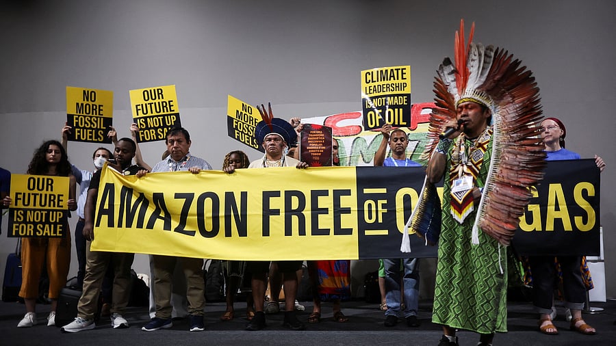 <div class="paragraphs"><p>Activists and Indigenous people take part in a Stop EACOP campaign protest against fossil fuels during the UN Climate Change Conference (COP30) in Belem.</p></div>