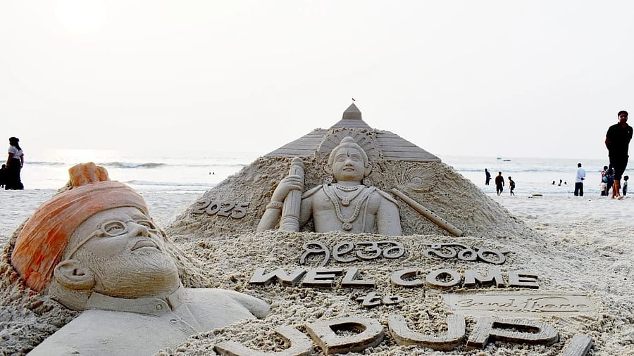 Members of Udupi-based ‘Sand Theme’ create a sand sculpture welcoming Prime Minister Narendra Modi to the Lakshakantha Gita recitation programme in Udupi, scheduled for Friday, at Malpe beach on Thursday.