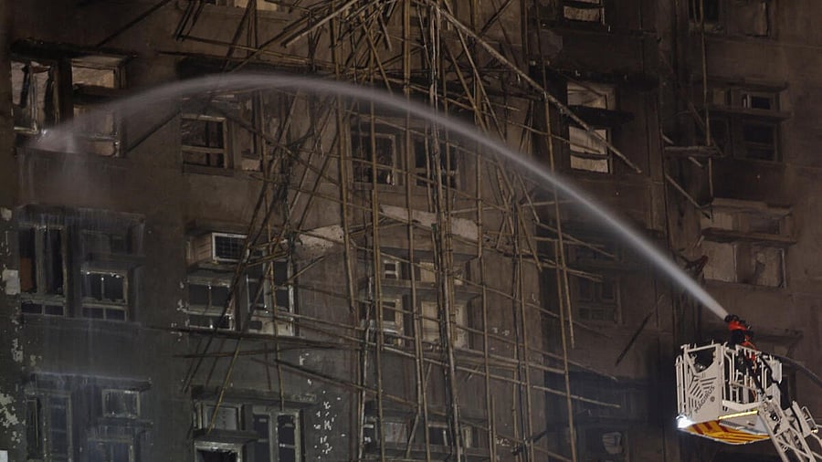 <div class="paragraphs"><p>Water is hosed towards a burnt building, after a deadly fire broke out yesterday at Wang Fuk Court housing complex, in Tai Po, Hong Kong, China.</p></div>