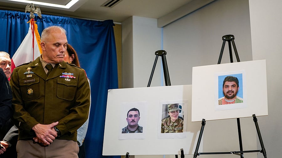<div class="paragraphs"><p>Brigadier General Leland D. Blanchard II looks towards pictures of two National Guard members who were shot in Washington on November 26, along with a picture of a suspect, Afghan national Rahmanullah Lakanwal.</p></div>