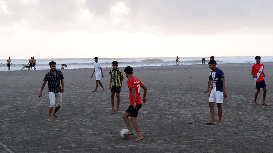 <div class="paragraphs"><p> A kickabout on Morjim beach in Goa.</p></div>