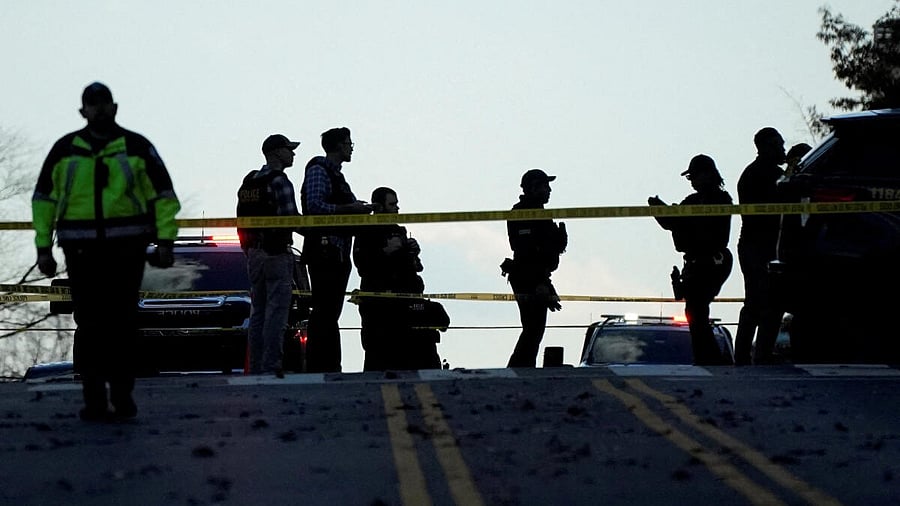<div class="paragraphs"><p>Law enforcement members gather in a cordoned-off area after two National Guard members were reportedly shot near the White House</p></div>