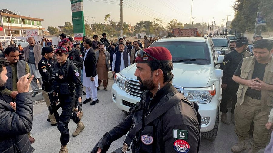 <div class="paragraphs"><p>Police commandos escort a vehicle carrying Sohail Afridi, leader of Pakistan's jailed former Prime Minister Imran Khan's party, as he arrives to visit him, outside Adiala Jail in Rawalpindi</p><p></p></div>