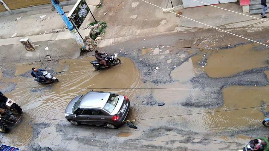 The road connecting glass factory layout with the fruit market in Anekal is in a deplorable state.