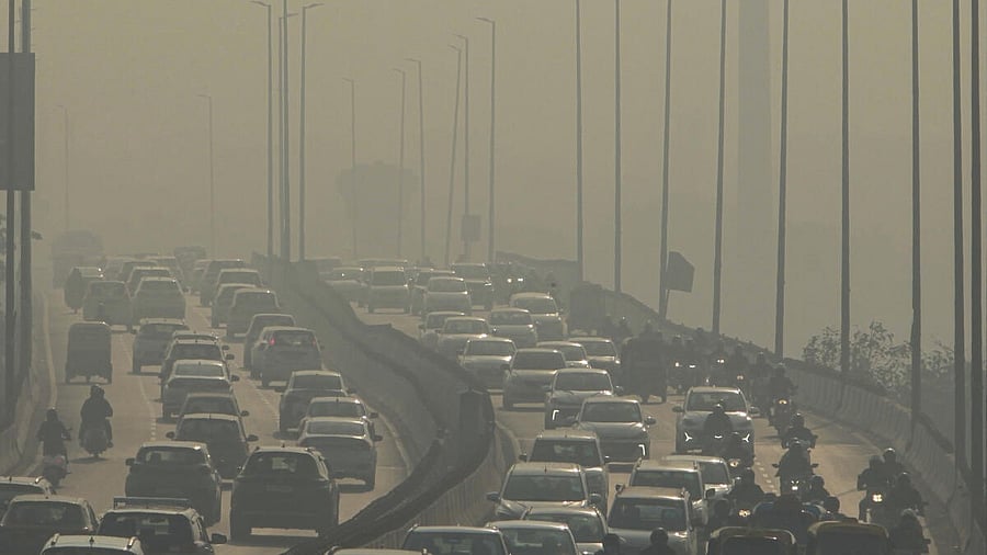 <div class="paragraphs"><p>Vehicles ply on Barapullah flyover on a smoggy winter morning, in New Delhi.</p></div>
