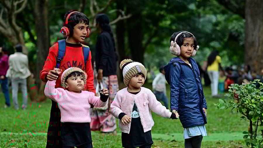 Amid the gentle winter chill, children enjoy themselves at Cubbon Park on Sunday, running across the lawns, playing games, and soaking in the weekend sunshine. DH PHOTO/RANJU P