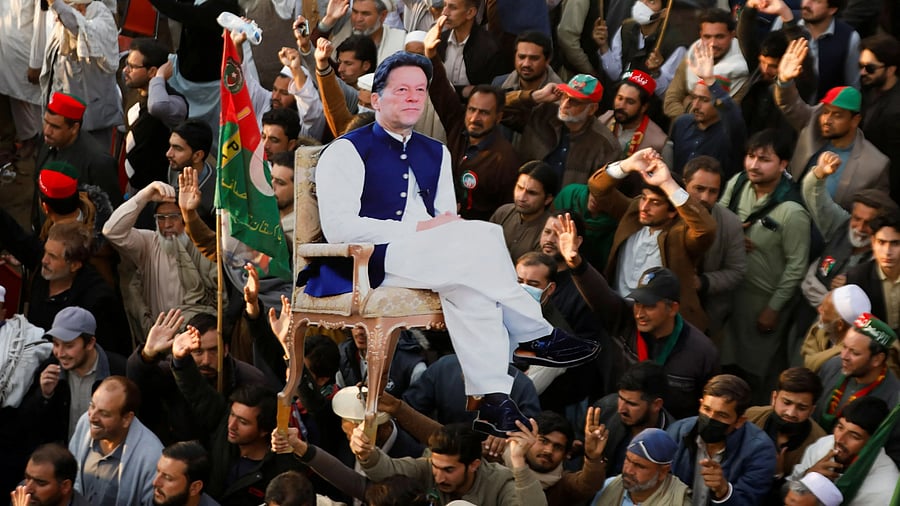 <div class="paragraphs"><p>Supporters of the former Pakistani Prime Minister Imran Khan's party, the Pakistan Tehreek-e-Insaf , carry a cutout of him.</p></div>