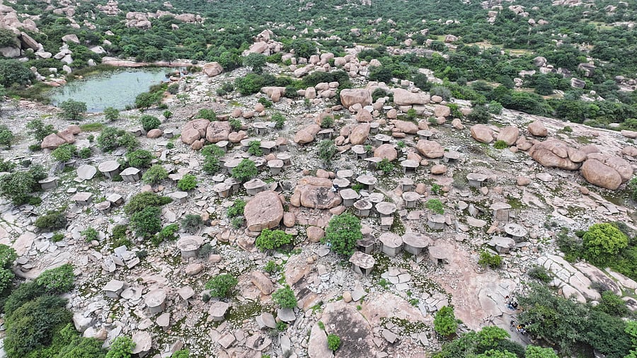 <div class="paragraphs"><p>An aerial view of the central cluster of dolmens at Hire Benakal near Gangavati, with the rock pool at top left. </p></div>