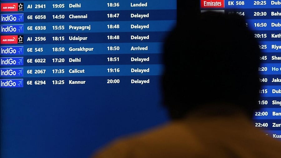 <div class="paragraphs"><p>A man looks at a fight schedule screen displaying several delayed flights by IndiGo airlines at the Chhatrapati Shivaji Maharaj International Airport in Mumbai.</p></div>