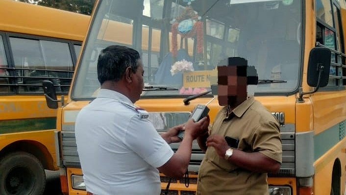 <div class="paragraphs"><p>A policeman makes a driver blow into a breathalyzer. Image for representational purpose.</p></div>